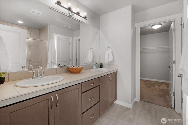 803 Loves Hill Dr, Sultan, WA 98294 - bathroom featuring double vanity, a shower stall, a spacious closet, and tile patterned floors