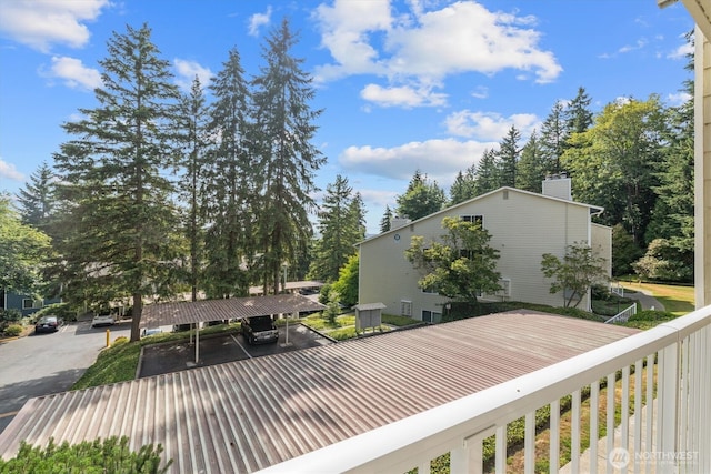 9484 Redmond-Woodinville Rd NE Unit C-205, Redmond, WA 98052 - wooden deck with view of wooded area