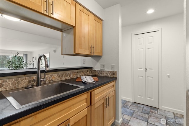 9484 Redmond-Woodinville Rd NE Unit C-205, Redmond, WA 98052 - kitchen featuring stone finish flooring, dark countertops, backsplash, recessed lighting, and plenty of natural light