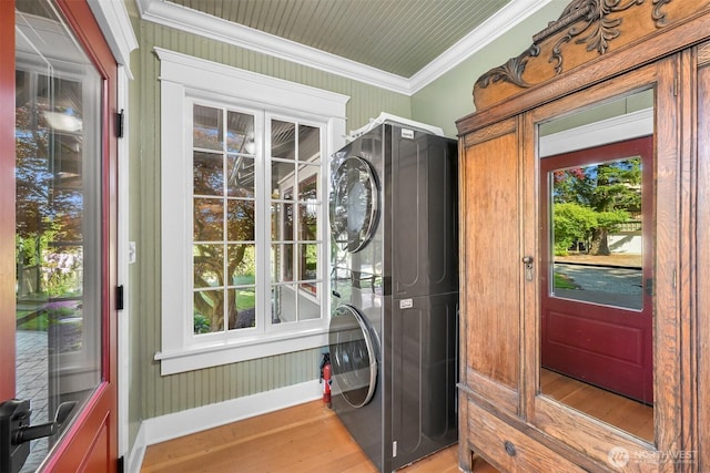 2234 Main St, Ferndale, WA 98248 - laundry room with stacked washer / dryer, light wood-style flooring, and ornamental molding
