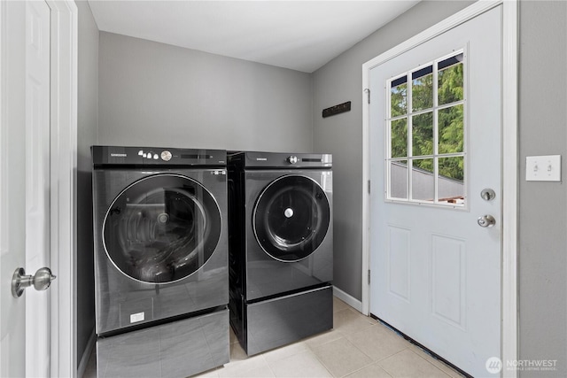 29319 132nd Ave E, Graham, WA 98338 - laundry area featuring washing machine and clothes dryer and light tile patterned flooring