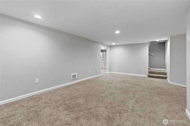 29319 132nd Ave E, Graham, WA 98338 - finished basement with freestanding refrigerator, recessed lighting, carpet floors, and stairway