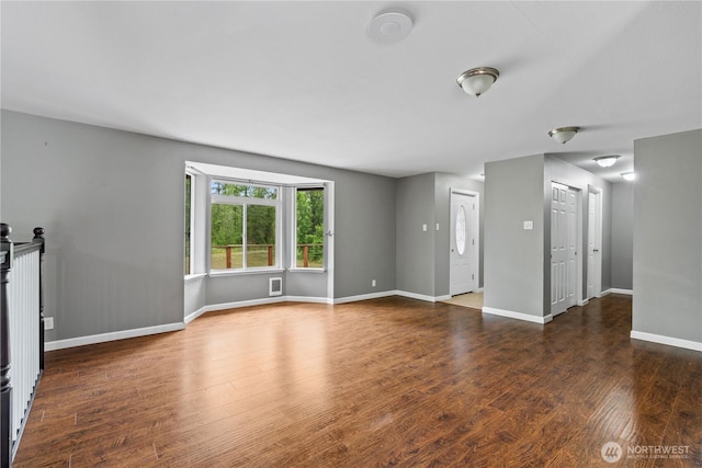 29319 132nd Ave E, Graham, WA 98338 - unfurnished living room with wood finished floors and baseboards