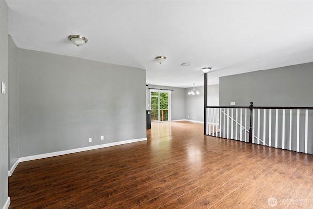 29319 132nd Ave E, Graham, WA 98338 - spare room with wood finished floors and a chandelier