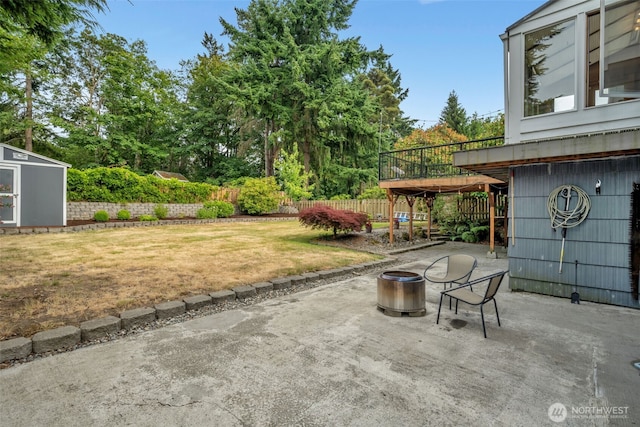 13102 16th Ave SW, Burien, WA 98146 - fenced backyard featuring a patio and a storage unit