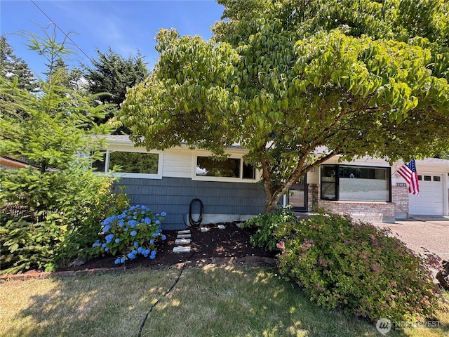 13102 16th Ave SW, Burien, WA 98146 - obstructed view of property with brick siding and an attached garage