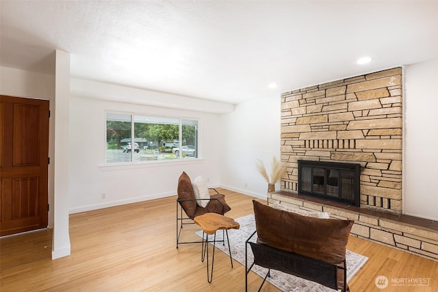 150 Sunland Dr, Sequim, WA 98382 - living room featuring light wood-style floors and a stone fireplace
