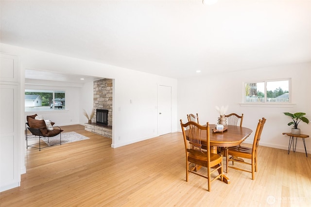 150 Sunland Dr, Sequim, WA 98382 - dining space with light wood-type flooring and a stone fireplace