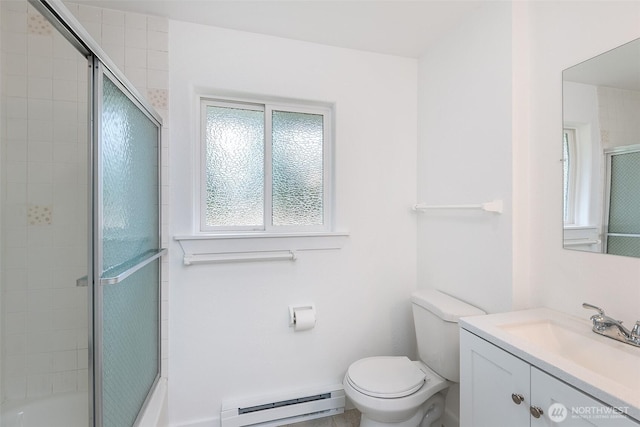 150 Sunland Dr, Sequim, WA 98382 - bathroom featuring a baseboard heating unit, vanity, and enclosed tub / shower combo