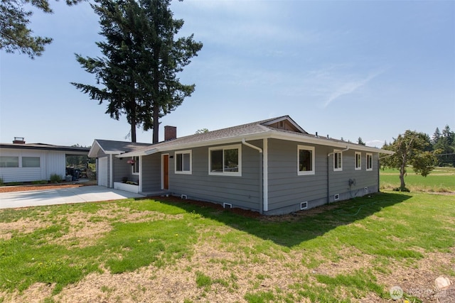 150 Sunland Dr, Sequim, WA 98382 - single story home featuring a chimney, a front yard, concrete driveway, and a garage