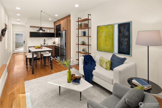 3626 1st Ave NW Unit A, Seattle, WA 98107 - living area featuring light wood-style flooring and recessed lighting