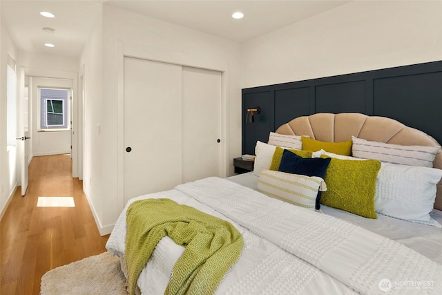 3626 1st Ave NW Unit A, Seattle, WA 98107 - bedroom featuring a closet, wood finished floors, and recessed lighting
