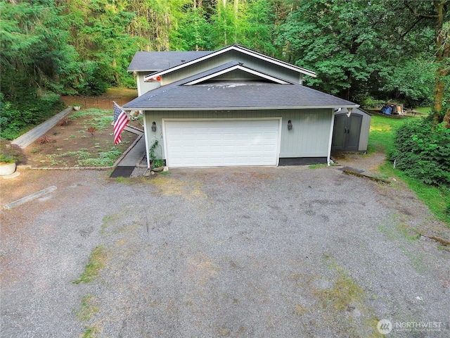11108 Pilchuck Ct SE, Olympia, WA 98501 - detached garage with a shed and a view of trees
