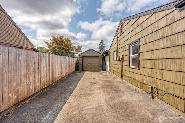 218 125th St S, Tacoma, WA 98444 - view of home's exterior with driveway and a garage