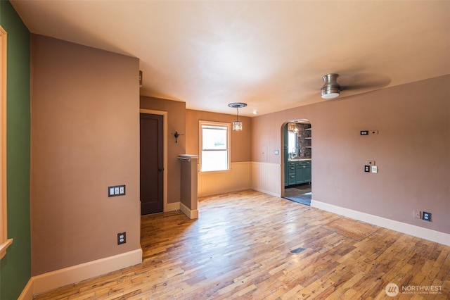 218 125th St S, Tacoma, WA 98444 - unfurnished room featuring arched walkways, a ceiling fan, and light wood finished floors
