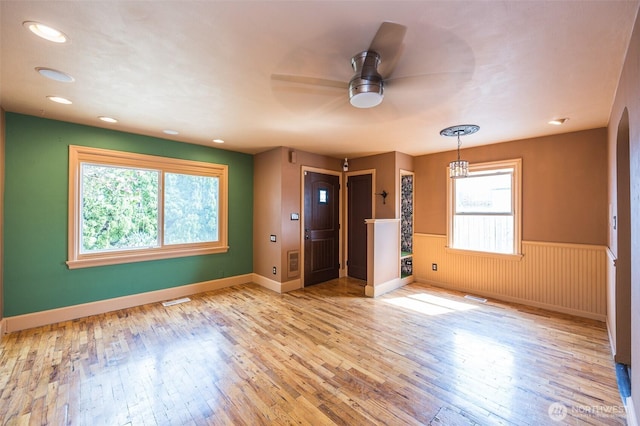 218 125th St S, Tacoma, WA 98444 - empty room featuring a ceiling fan, hardwood / wood-style floors, wainscoting, and recessed lighting