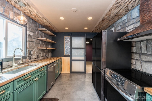 218 125th St S, Tacoma, WA 98444 - kitchen with appliances with stainless steel finishes, wooden counters, green cabinets, open shelves, and recessed lighting