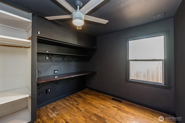 218 125th St S, Tacoma, WA 98444 - kitchen featuring ceiling fan, open shelves, and wood finished floors