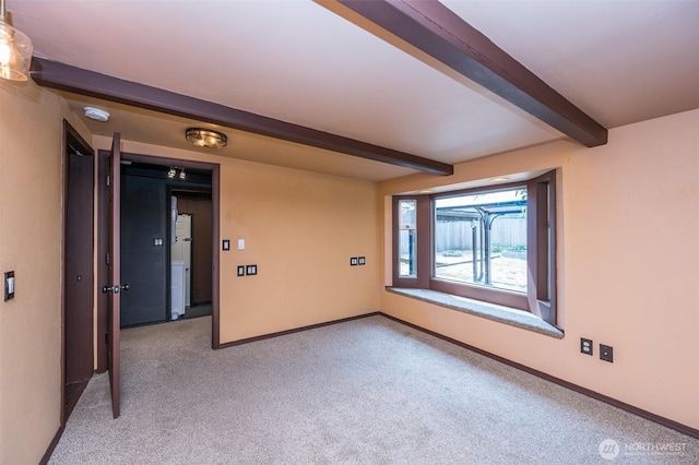 218 125th St S, Tacoma, WA 98444 - empty room with beamed ceiling, carpet, and a smoke detector