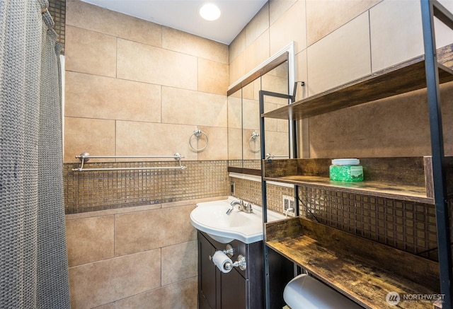 218 125th St S, Tacoma, WA 98444 - bathroom with vanity, tasteful backsplash, and tile walls