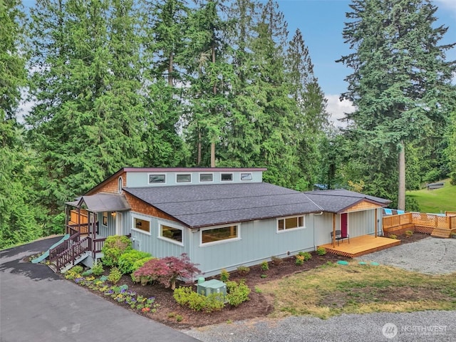 16121 Cedar Grove Rd SE, Issaquah, WA 98027 - view of front of home with a shingled roof and a deck