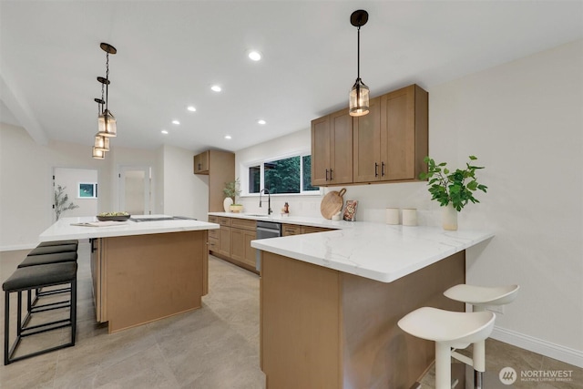 16121 Cedar Grove Rd SE, Issaquah, WA 98027 - kitchen featuring a kitchen breakfast bar, stainless steel dishwasher, recessed lighting, a peninsula, and pendant lighting