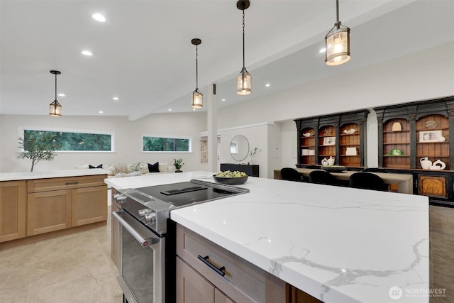 16121 Cedar Grove Rd SE, Issaquah, WA 98027 - kitchen with stainless steel range with electric cooktop, light stone countertops, recessed lighting, and decorative light fixtures