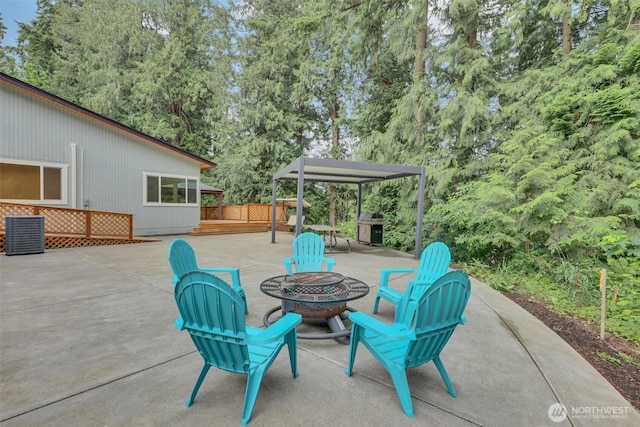 16121 Cedar Grove Rd SE, Issaquah, WA 98027 - view of patio / terrace with a fire pit, grilling area, and view of scattered trees