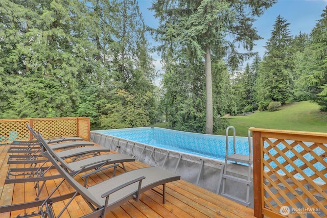 16121 Cedar Grove Rd SE, Issaquah, WA 98027 - swimming pool featuring a wooden deck, a yard, and outdoor dining area
