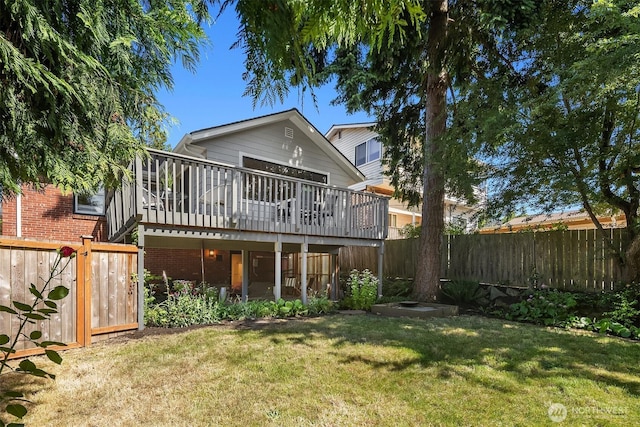 6045 36th Ave SW, Seattle, WA 98126 - back of property with a deck, a fenced backyard, and brick siding