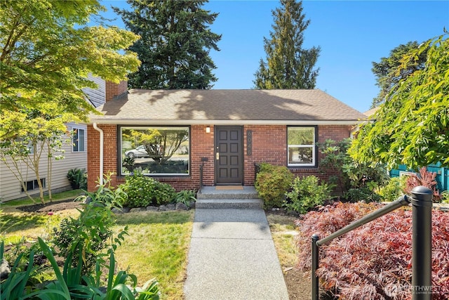 6045 36th Ave SW, Seattle, WA 98126 - view of front of house with a chimney, brick siding, and a shingled roof