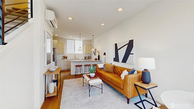 4250 Linden Ave N, Seattle, WA 98103 - living area with a wall mounted air conditioner, light wood-style floors, and recessed lighting
