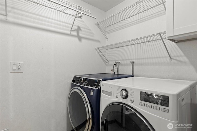 18020 SE 146th St, Renton, WA 98059 - laundry area with cabinet space and washing machine and clothes dryer