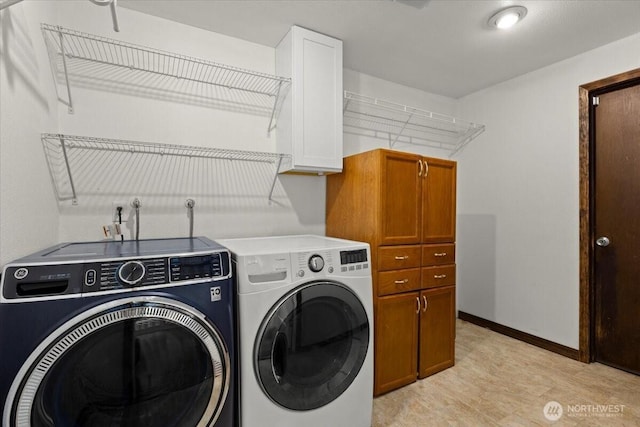 18020 SE 146th St, Renton, WA 98059 - laundry area featuring cabinet space, washer and dryer, and light wood-style floors
