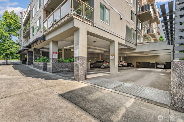 11011 NE 12th St Unit 501, Bellevue, WA 98004 - view of building exterior featuring covered parking