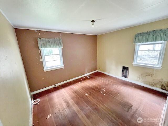 4140 Poplar Way, Longview, WA 98632 - unfurnished room featuring hardwood / wood-style flooring and heating unit