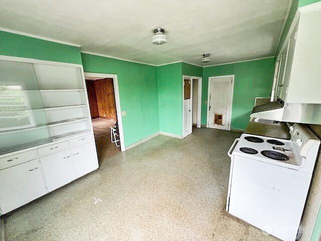 4140 Poplar Way, Longview, WA 98632 - kitchen with electric range and white cabinetry