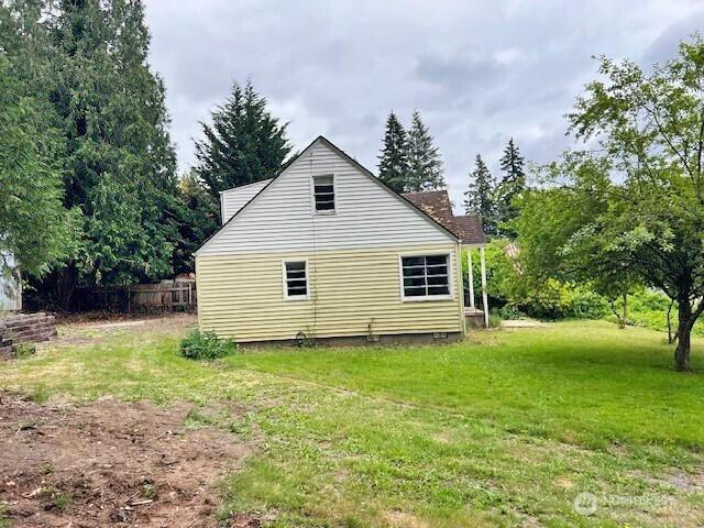 4140 Poplar Way, Longview, WA 98632 - view of home's exterior with a lawn
