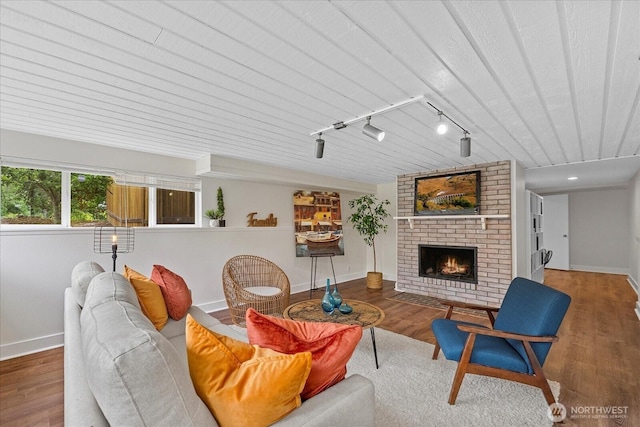 4505 144th Ave SE, Bellevue, WA 98006 - living area with a brick fireplace, wood finished floors, and rail lighting