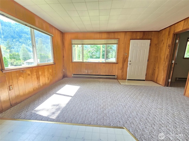 362 Lakeside Dr, Sedro Woolley, WA 98284 - carpeted empty room featuring a baseboard radiator and wood walls