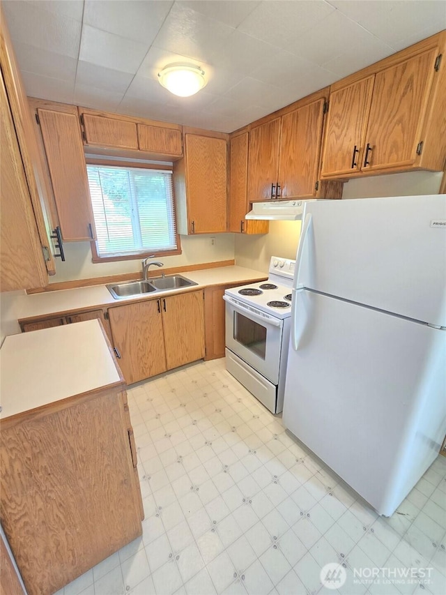 362 Lakeside Dr, Sedro Woolley, WA 98284 - kitchen featuring white appliances, light flooring, under cabinet range hood, and light countertops