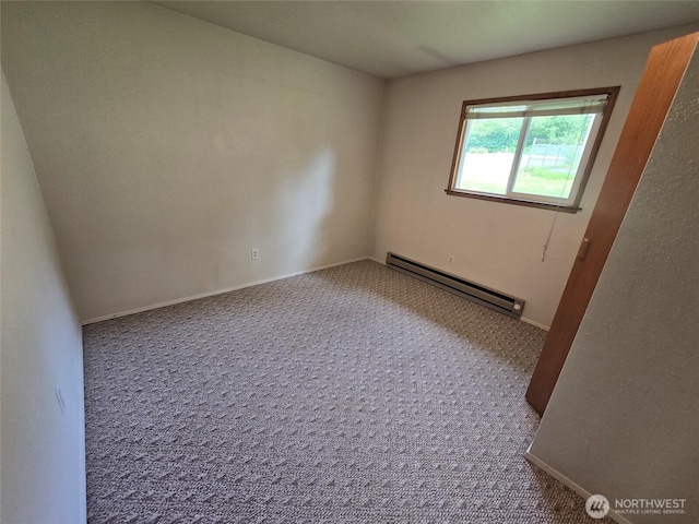 362 Lakeside Dr, Sedro Woolley, WA 98284 - spare room with a baseboard radiator and carpet