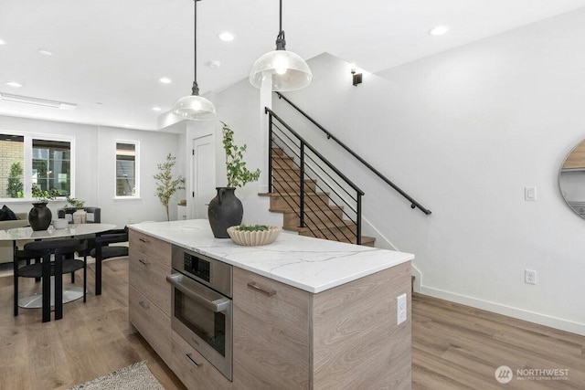 118B 2nd St S, Kirkland, WA 98033 - kitchen with modern cabinets, light wood finished floors, recessed lighting, decorative light fixtures, and a center island