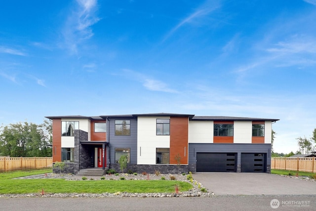 2768 W Wiser Lake Ct, Ferndale, WA 98248 - contemporary home with stone siding, an attached garage, and concrete driveway