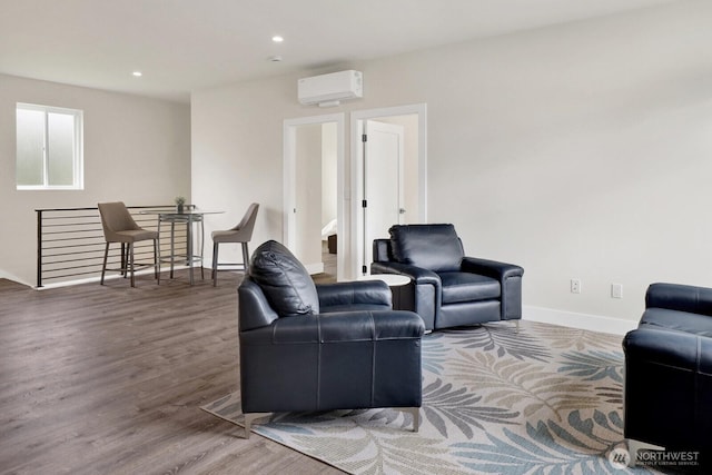 2768 W Wiser Lake Ct, Ferndale, WA 98248 - living room featuring a wall mounted AC, wood finished floors, and recessed lighting