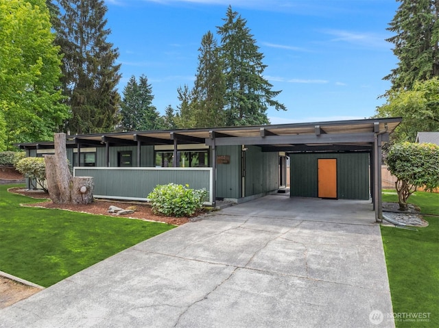 6602 35th St W, University Place, WA 98466 - mid-century inspired home with a front lawn, driveway, and a carport
