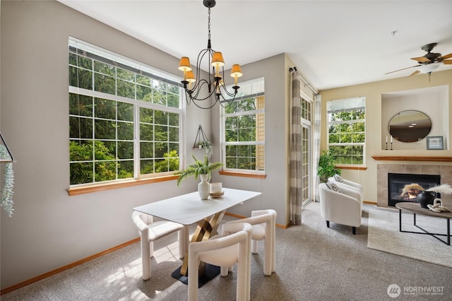 1855 Trossachs Blvd SE Unit 2002, Sammamish, WA 98075 - carpeted dining space with a chandelier, a ceiling fan, and a tiled fireplace