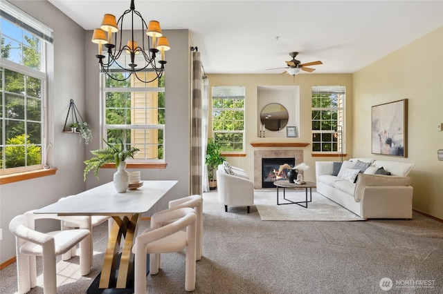 1855 Trossachs Blvd SE Unit 2002, Sammamish, WA 98075 - dining room with carpet flooring, a chandelier, a ceiling fan, and a tiled fireplace