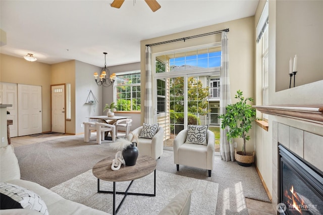1855 Trossachs Blvd SE Unit 2002, Sammamish, WA 98075 - living room featuring light colored carpet, a fireplace, a chandelier, and ceiling fan