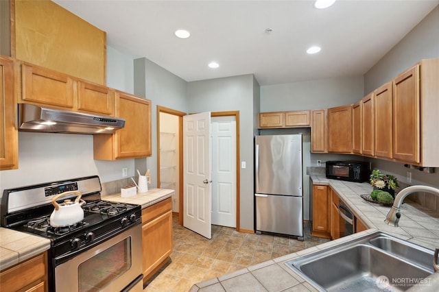 1855 Trossachs Blvd SE Unit 2002, Sammamish, WA 98075 - kitchen with stainless steel appliances, under cabinet range hood, tile counters, recessed lighting, and light brown cabinetry